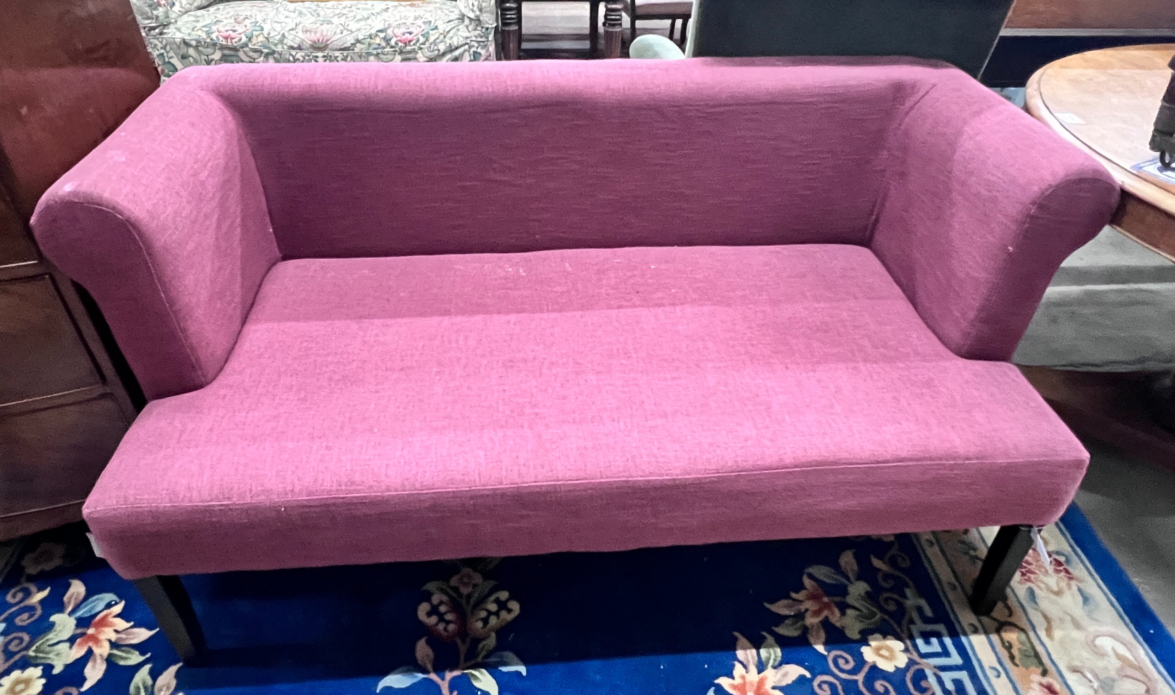 A contemporary Ambience settee upholstered in a plum fabric on square tapered legs, length 150cm, depth 70cm, height 75cm